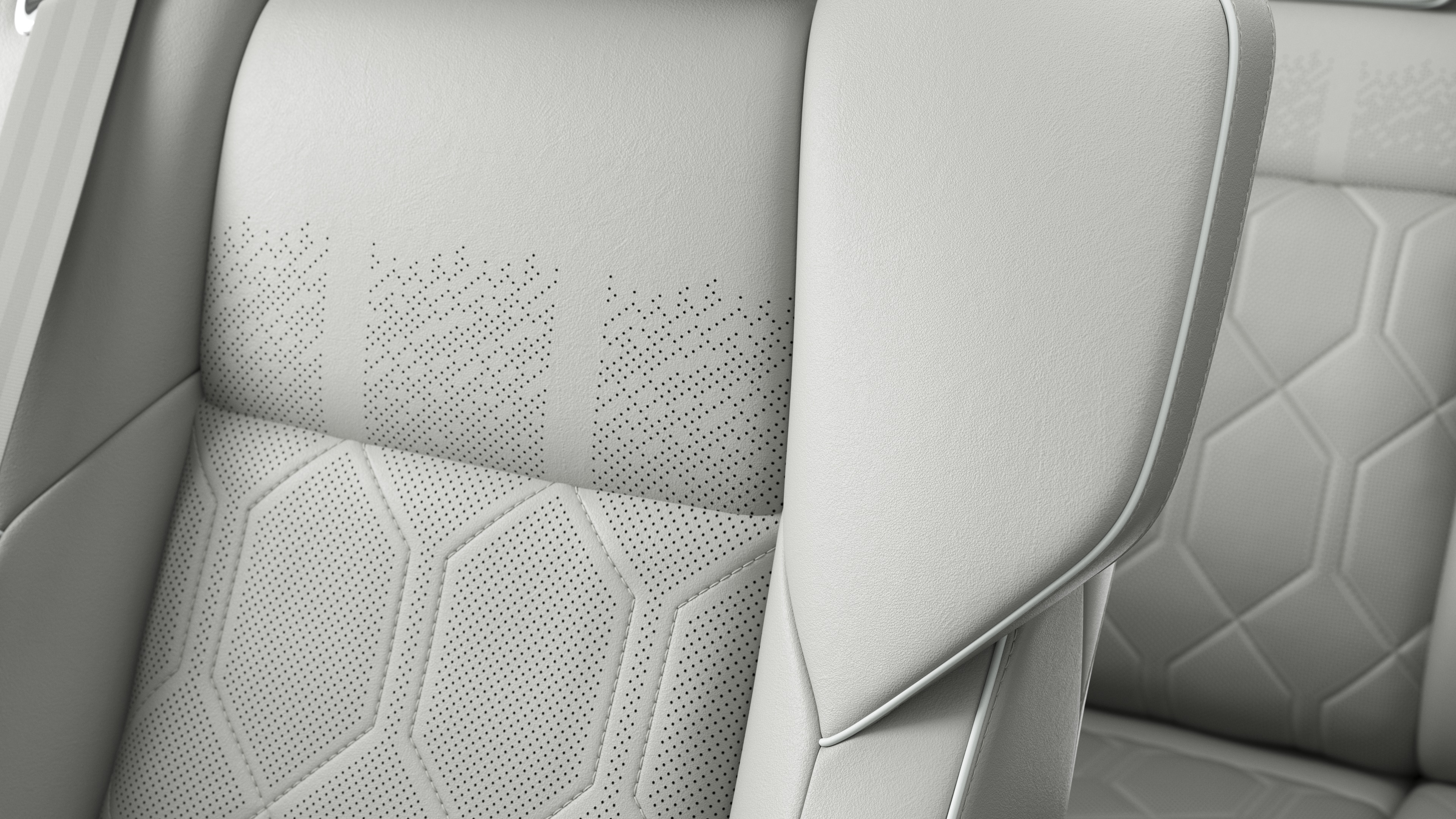沃尔沃汽车内部座椅细节的特写，显示缝线和瑞典小旗牌。