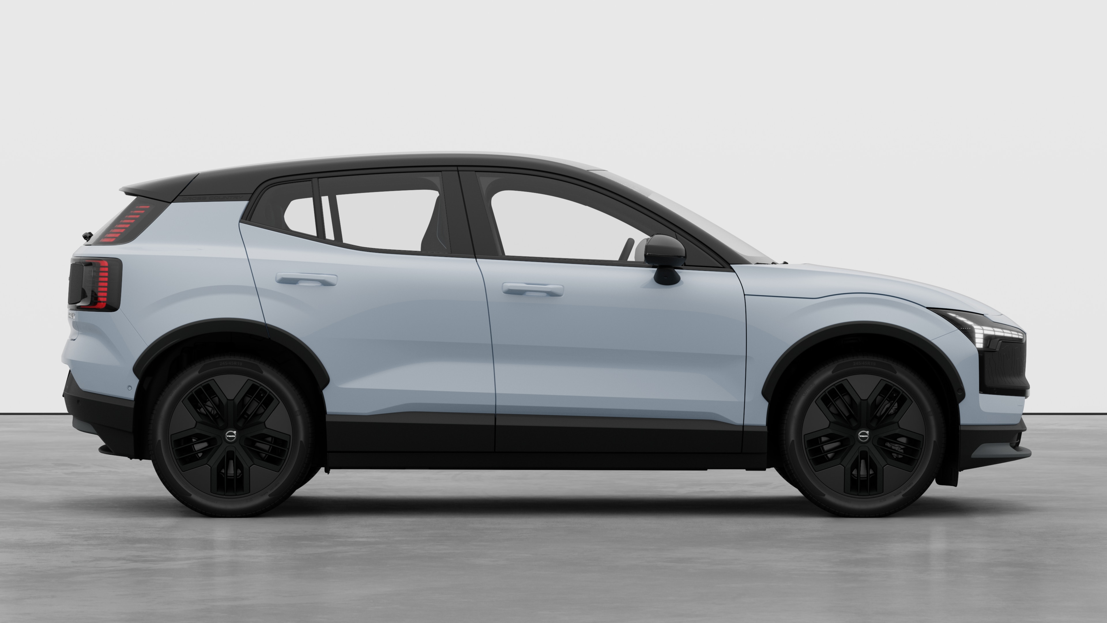 沃尔沃汽车侧视图在纯工作室背景上显示关闭的车门和可见的车轮设计。